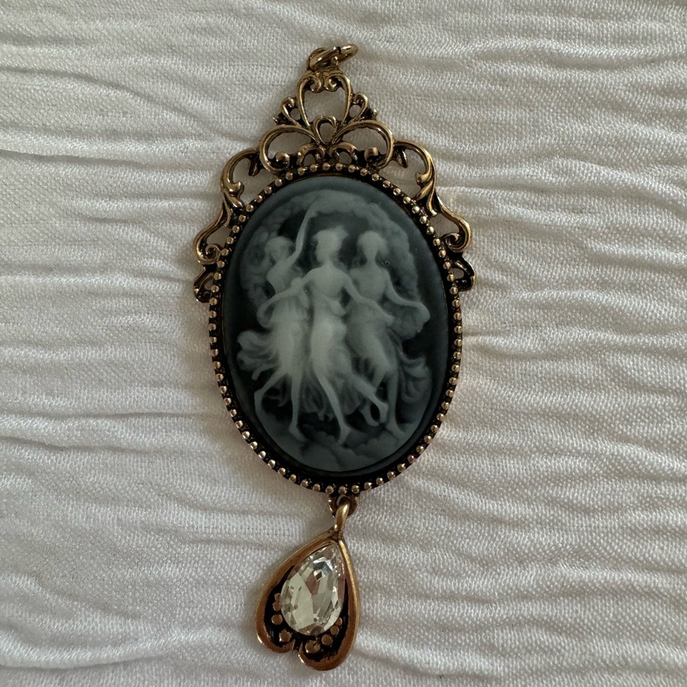 Gothic-inspired black and white cameo pendant with crystal heart charm